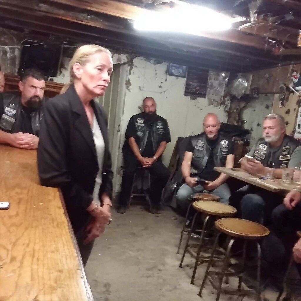 I hired bikers to scare my daughter’s stalker but they did something I never expected. When I walked into that motorcycle clubhouse with $500 in cash and desperation in my eyes, I expected violence. I wanted violence. I was ready to pay for violence. “I need someone hurt,” I told the bearded giant behind the bar. My hands were shaking as I placed the money on the scarred wood. “There’s a man stalking my daughter. The police won’t help. I need him gone.” The room went quiet. Twenty sets of eyes turned to look at me—a forty-five-year-old suburban mom in my real estate blazer and sensible heels, standing in a room full of leather and tattoos and men who looked like they’d seen the worst of humanity. The man behind the bar didn’t touch the money. “Ma’am, why don’t you sit down and tell us what’s really going on.” That’s not what I expected him to say. “I don’t have time for talking. My daughter Emma is nineteen. This man is thirty-seven. He follows her everywhere. Shows up at her college. Her work. Our house. He leaves gifts. Sends messages. The police say he hasn’t broken any laws.” My voice cracked. “Last week he left a photo under her windshield wiper. A photo of her sleeping. Taken through her bedroom window.” Several bikers stood up. The tension in the room shifted. “You show that to the cops?” asked a man with a gray ponytail. “Of course I did. They said it proved he was on our property but since he didn’t break in or make explicit threats, it’s just trespassing. They gave him a warning.” I laughed bitterly. “A warning. He took a photo of my baby girl sleeping and they gave him a warning.” The man behind the bar came around and sat across from me. His vest said “Thomas” and underneath, “President.” “What’s this man’s name?” “Richard Kelley. He works at the hardware store downtown. Lives in the Riverside apartment complex. Drives a white Honda Civic.” I’d memorized everything about him. “He first saw Emma at the coffee shop where she works. Started coming in three times a day. She had to quit that job because of him.” Thomas picked up my money and handed it back to me. “We’re not going to hurt him, ma’am.” My heart sank. “Then I’ll find someone who will.” “No,” Thomas said firmly. “You won’t. Because we won’t……… (continue reading in the C0MMENT)